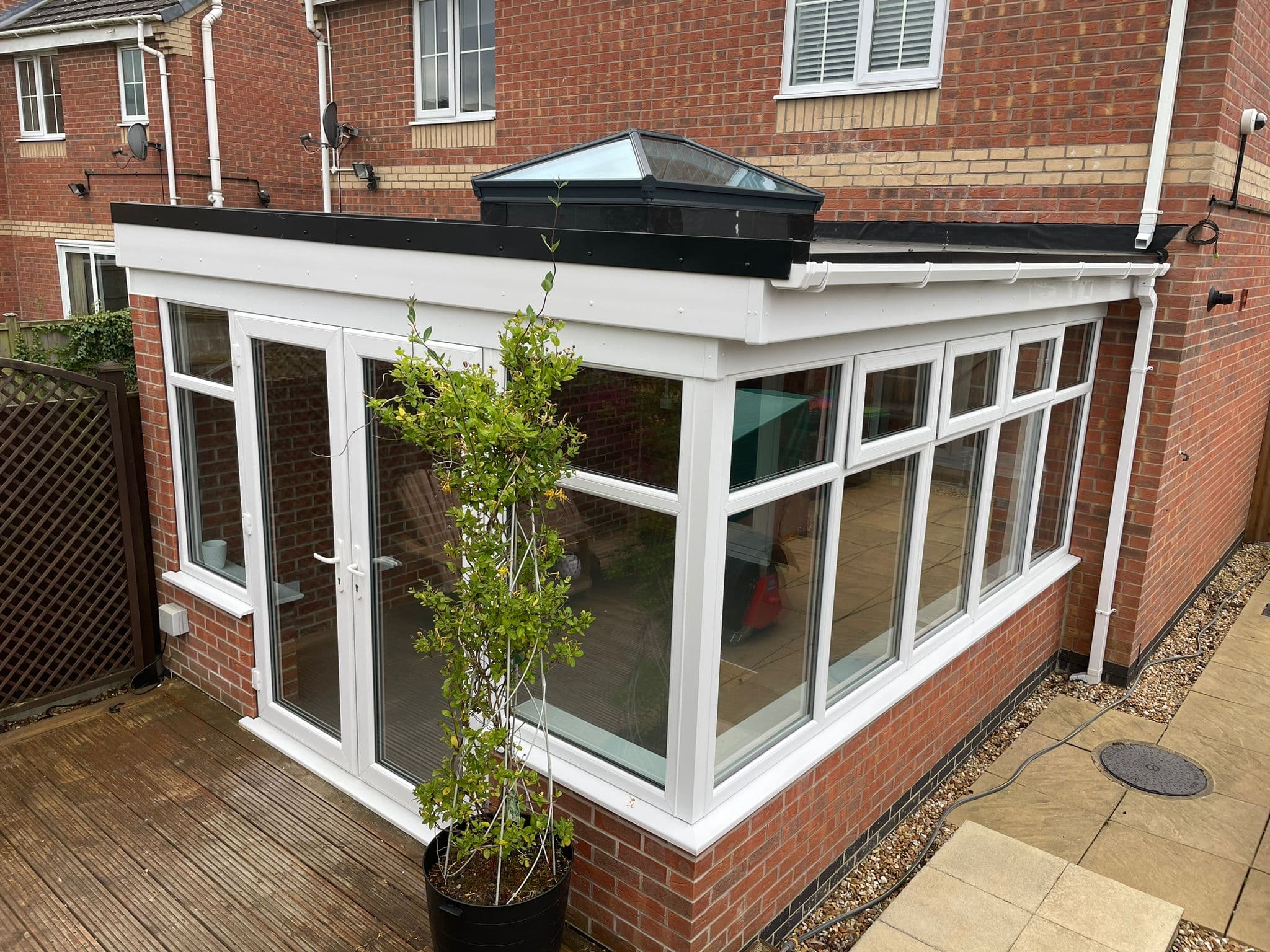 Replaced conservatory roof with insulated tiles and a roof lantern