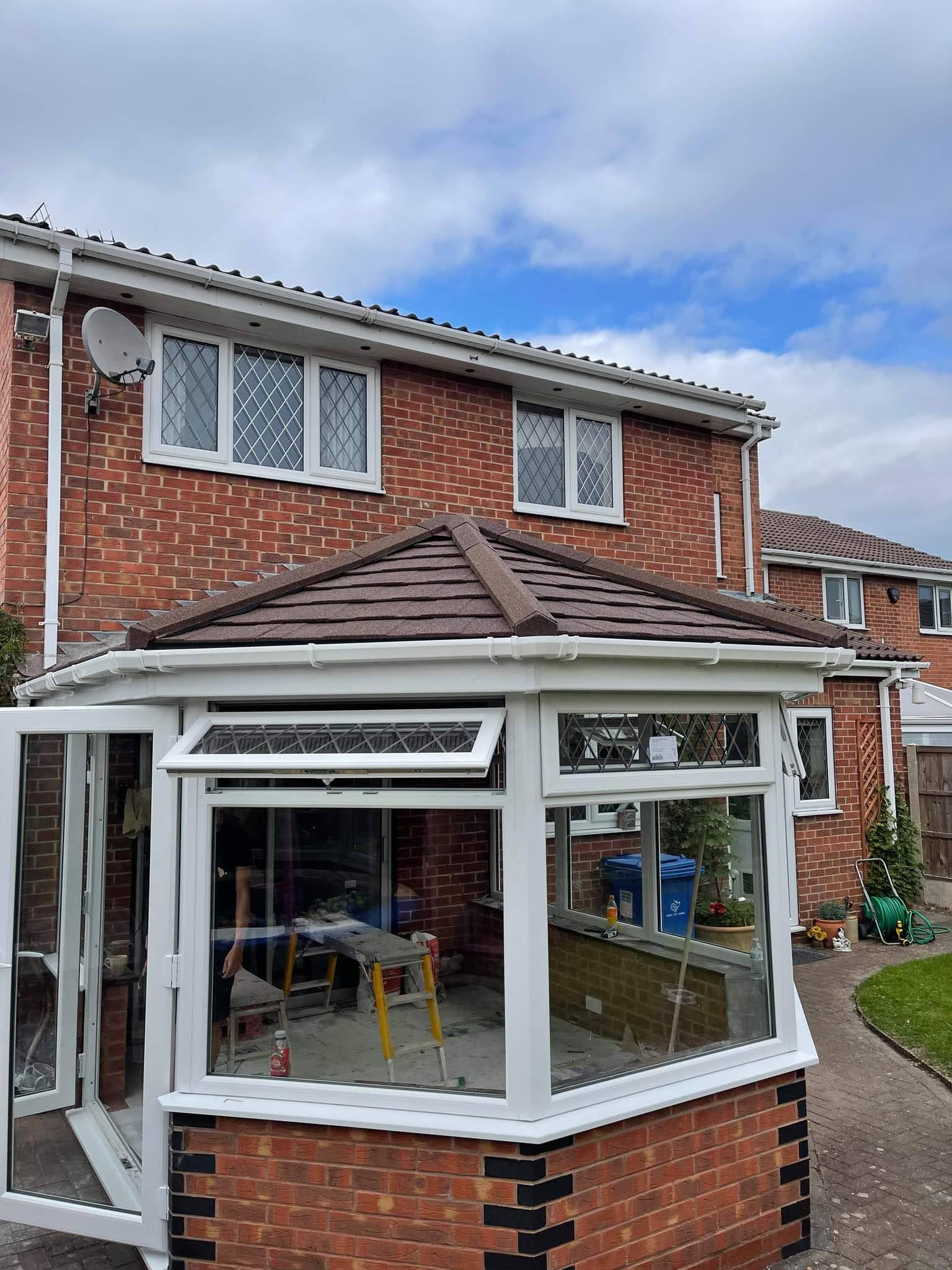 Conservatory with a new tiled warm roof replacing the old glass roof